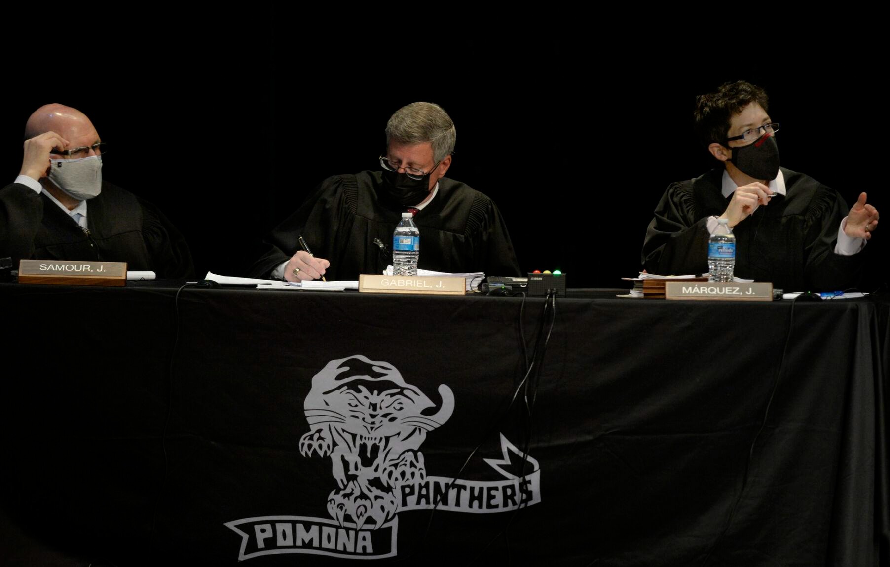 ARVADA, CO - OCTOBER 26: The Colorado Supreme Court, including left to right, justices Carlos A. Samour Jr., Richard L. Gabriel, and Monica M. Márquez.